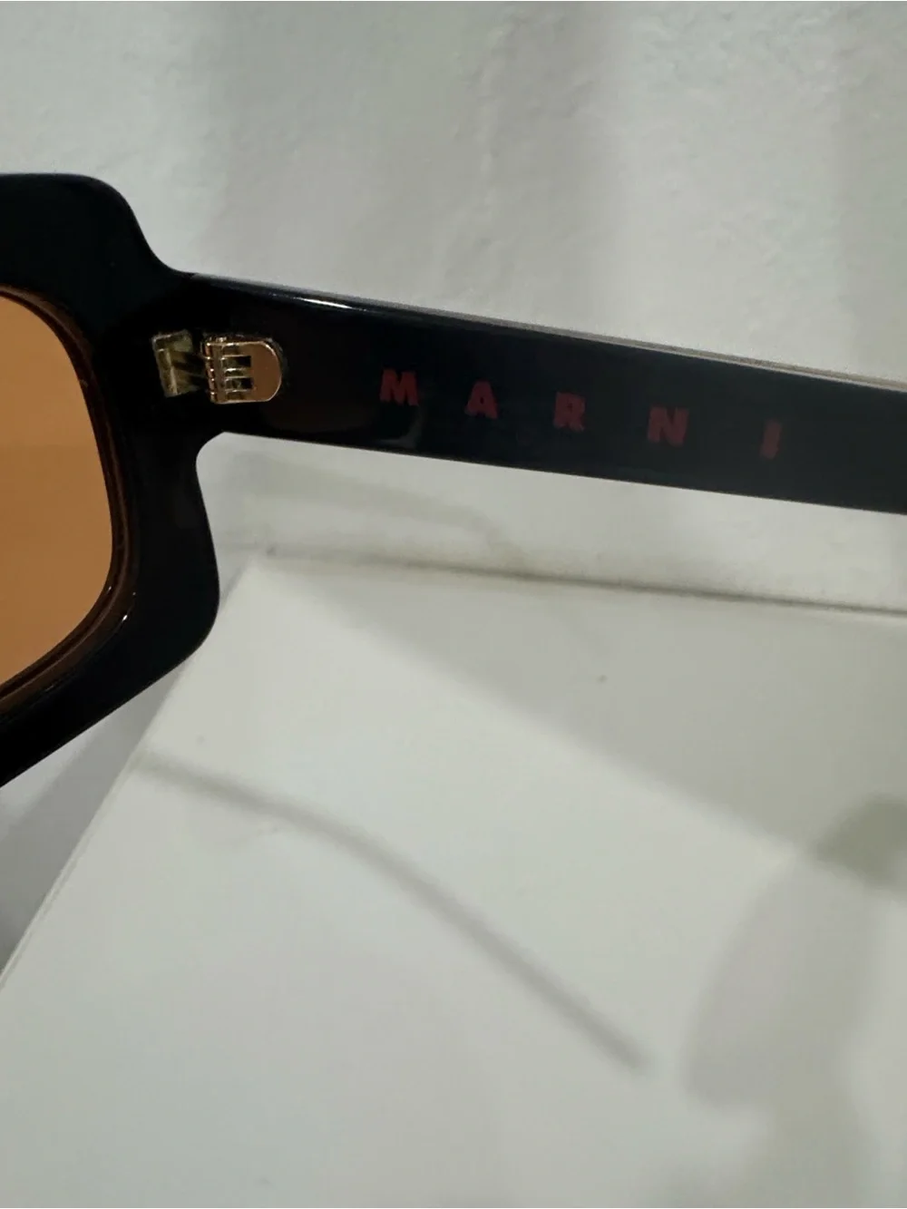 Marni Black Frame Sunglasses with Amber Lenses